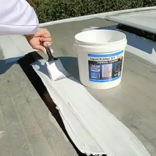 First thermal coating being applied to caravan roof